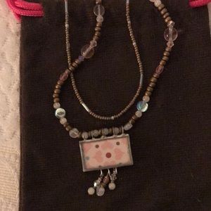Beaded double stand necklace.
